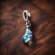 Blue Glass Slipper Trio Charm - Blue Glass Slipper Trio Charm — display on walnut