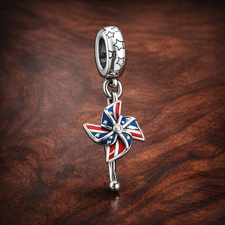 Union Jack Pinwheel Charm - Union Jack Pinwheel Charm — display on walnut