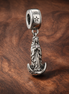 Rocket Moon and Stars Charm - Rocket Moon and Stars Charm — display on walnut