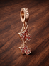 Rose Gold Plated Heart Key Charm - Rose Gold Plated Heart Key Charm — display on walnut