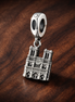 Silver City Skyline Charm - Silver City Skyline Charm — display on walnut