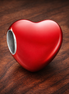 Color-changing Hidden Message Heart Charm — display on walnut