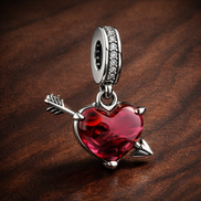Arrow Through Heart Charm - Arrow Through Heart Charm — display on walnut