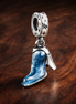 Disney Cinderella's Glass Slipper Dangle Charm — display on walnut