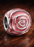 Pink Rose in Bloom Charm — display on walnut