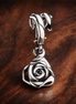 Rose in Bloom Dangle Charm — display on walnut