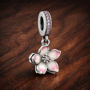 Cherry Blossom Dangle Charm — display on walnut