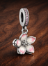 Cherry Blossom Dangle Charm — display on walnut