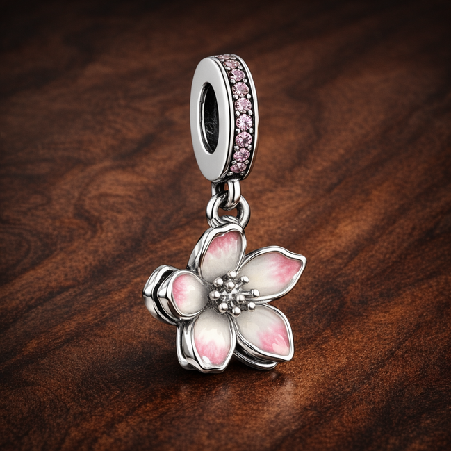 Cherry Blossom Dangle Charm — display on walnut