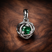 Green Eternity Circle Dangle Charm — display on walnut