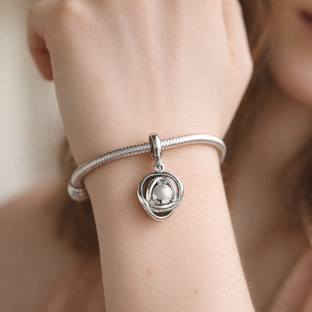 Clear Eternity Circle Dangle Charm — worn on wrist
