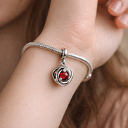Red Crystal Knot Charm - Red Crystal Knot Charm — worn on wrist