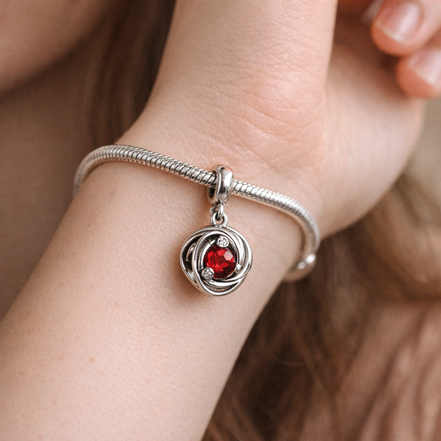 Red Crystal Knot Charm - Red Crystal Knot Charm — worn on wrist