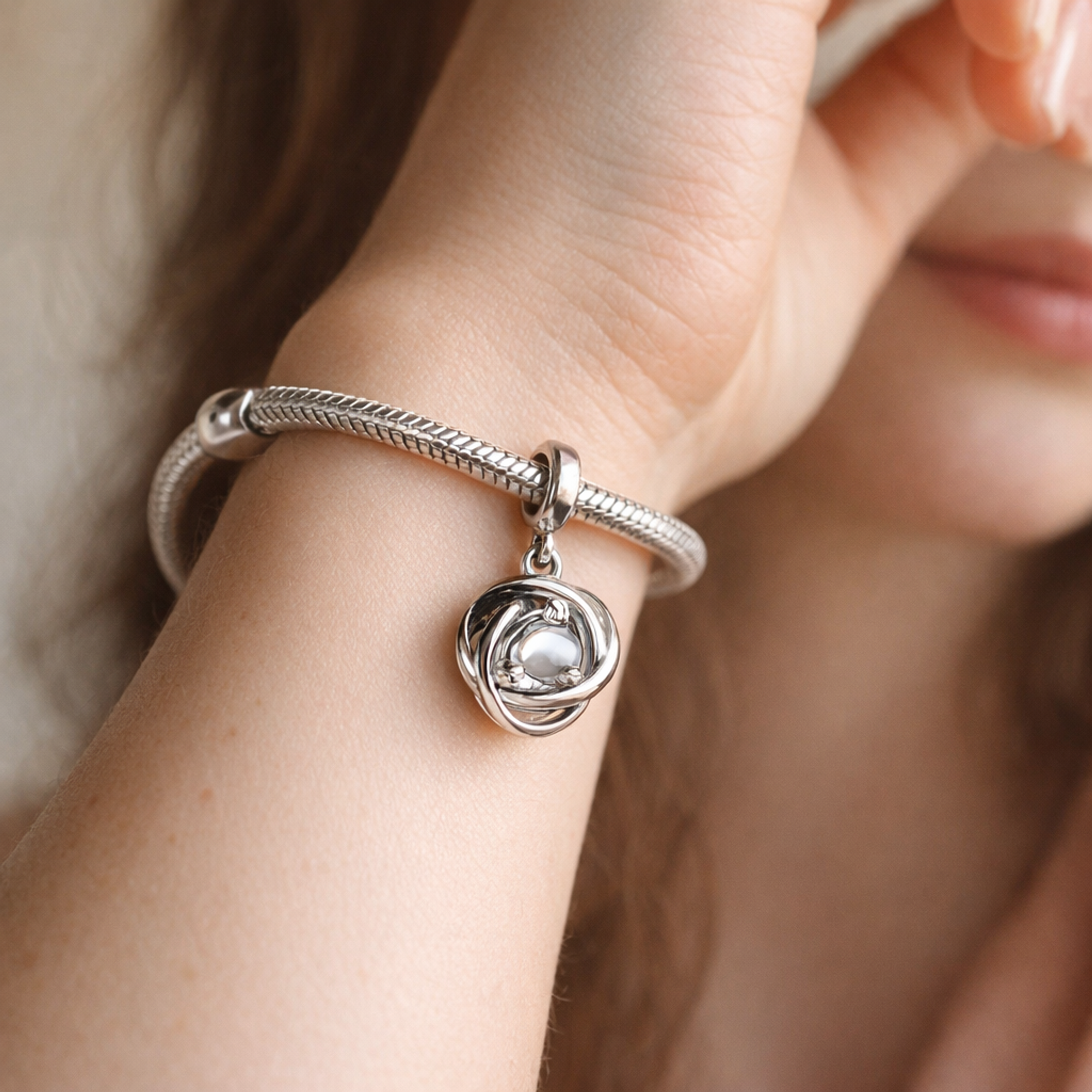 Silver Clear Knot Charm - Silver Clear Knot Charm — worn on wrist