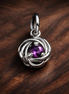 Purple Eternity Circle Dangle Charm — display on walnut