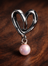Open Heart Pearl Dangle Charm - Open Heart Pearl Dangle Charm — display on walnut