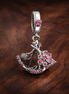 Minnie-Inspired Swing Charm - Minnie-Inspired Swing Charm — display on walnut
