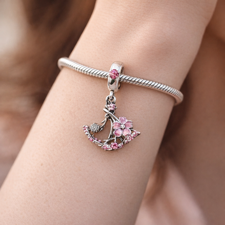 Minnie-Inspired Swing Charm - Minnie-Inspired Swing Charm — worn on wrist