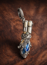 Blue Feather Dangle Charm - Blue Feather Dangle Charm — display on walnut
