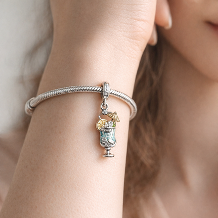 Blue Feather Dangle Charm - Blue Feather Dangle Charm — worn on wrist