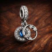 Moon Star Ring Dangle - Moon Star Ring Dangle Charm — display on walnut