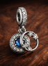 Moon Star Ring Dangle - Moon Star Ring Dangle Charm — display on walnut