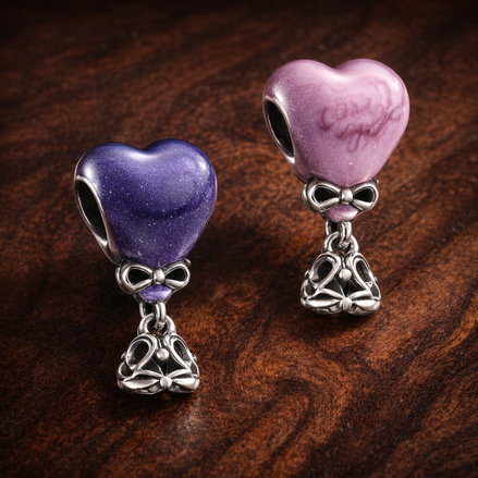 Color-changing Gender Reveal Girl Charm — display on walnut