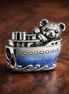 Steamboat Willie Ship Charm - Steamboat Willie Ship Charm — display on walnut