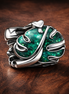 Green Monstera Leaf Charm - Green Monstera Leaf Charm — display on walnut
