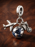 Airplane Passport Globe Charm - Airplane Passport Globe Charm — display on walnut