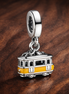 Yellow Trolley Charm - Yellow Trolley Charm — display on walnut