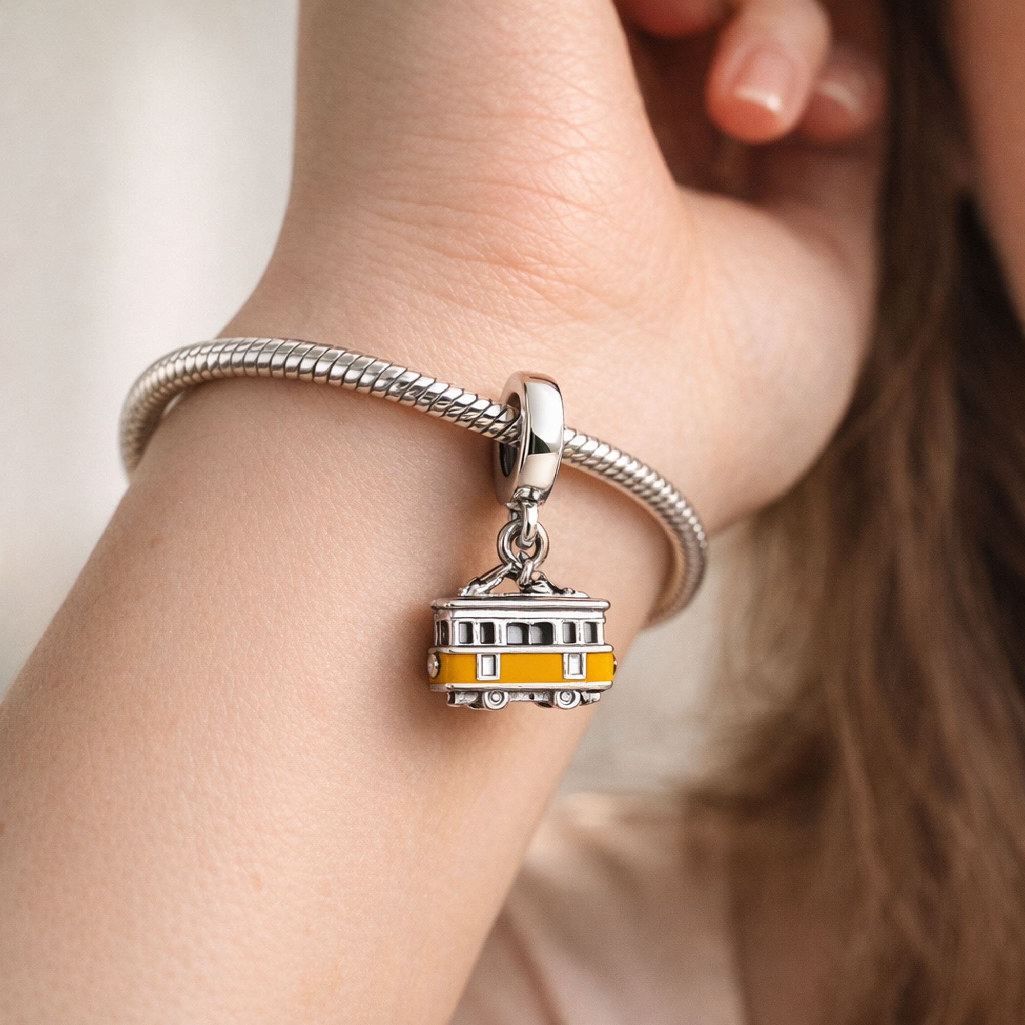 Yellow Trolley Charm - Yellow Trolley Charm — worn on wrist