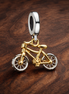 Gold Plated Bicycle Charm - Gold Plated Bicycle Charm — display on walnut