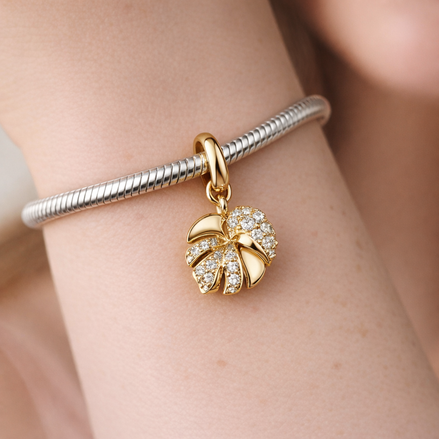 Sparkling Monstera Leaf Dangle Charm — worn on wrist