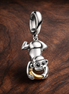 Donald Duck Upside-Down Charm - Donald Duck Upside-Down Charm — display on walnut