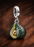 Avocado Double Dangle Charm — display on walnut