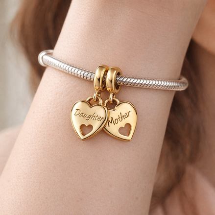 Double Heart Split Dangle Charm — worn on wrist