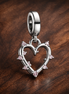 Friendship Opalescent Double Dangle Charm — display on walnut