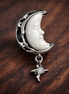 Moon & North Star Charm — display on walnut