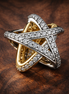 Sparkling Crossover Star Charm — display on walnut