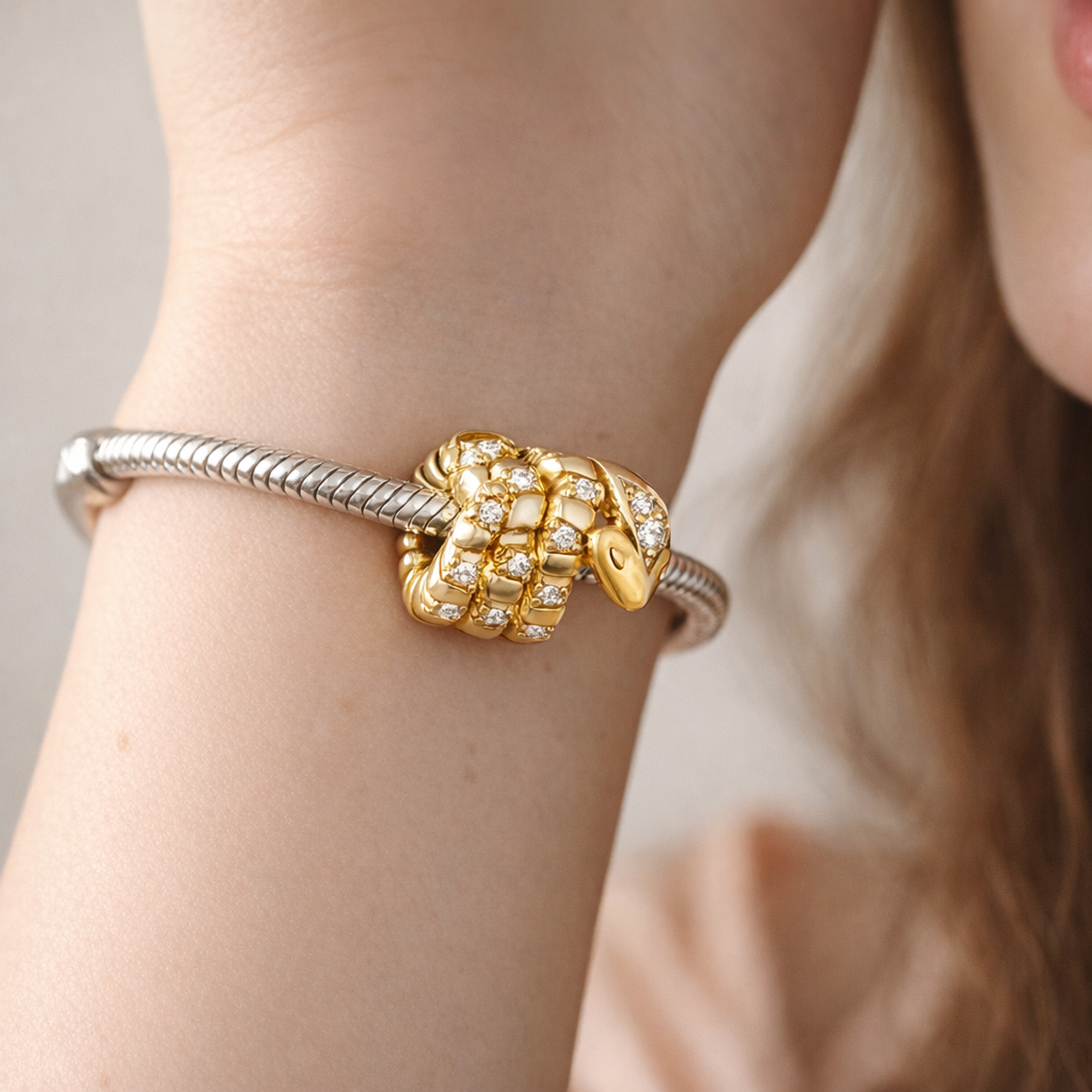 Curled Snake Charm — worn on wrist