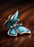 Oversized Butterfly Charm — display on walnut