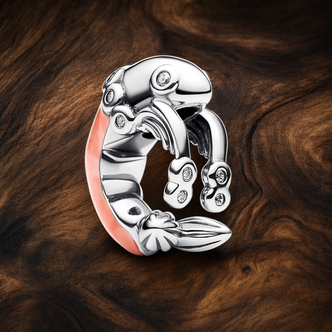 Disney Mickey Mouse Cupid Charm — display on walnut