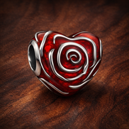 Rose Heart Charm — display on walnut