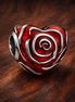 Rose Heart Charm — display on walnut