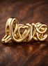 Handwritten Love Charm — display on walnut