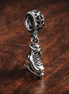 Snowflake Skate Dangle Charm - Snowflake Skate Charm — display on walnut
