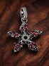 Red Crystal Snowflake Charm - Red Crystal Snowflake Charm — display on walnut