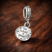 Sparkling Firework Double Dangle Charm — display on walnut