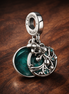 Animal Moon Dangle - Animal Moon Dangle Charm — display on walnut